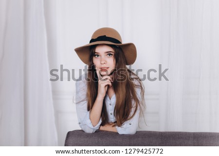 Close up portrait of young cheerful positive emotional casual girl in fashionable hat. Freedom lifestyle, natural beauty concept