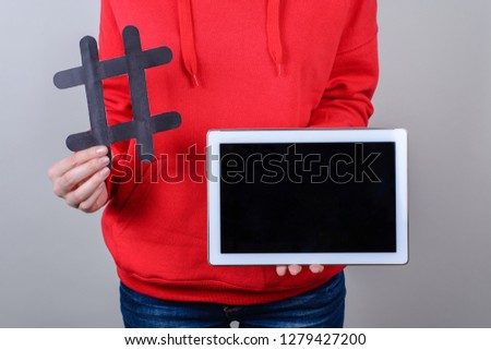 Information news concept. Close up photo of white portable digital tablet with black screen isolated gray background