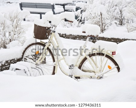 Fresh and white snow covered bike
