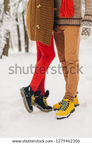 
couple in love hugging, legs closeup