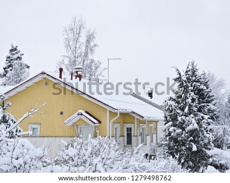 House roof covered with white snow