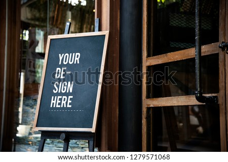 Blackboard sign mockup in front of a restaurant