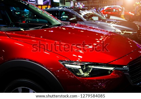 Row of new  cars on display at the Motor  motor exhibition show event of technology and  innovation of vehicle or transportation. Royalty-Free Stock Photo #1279584085