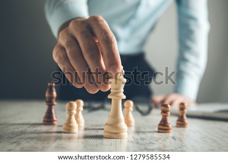 Man does first move in a chess game