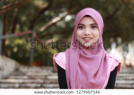 beautiful young Asian women with hijab. Cute portraiture. Pink hijab Royalty-Free Stock Photo #1279607146