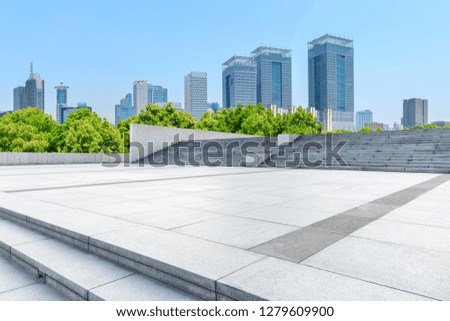 Empty square floor and modern commercial building in Shanghai