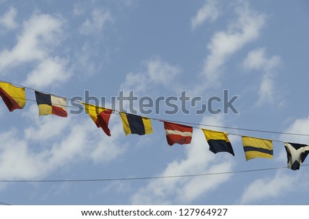  Sea flag and background is blue sky with white clouds..