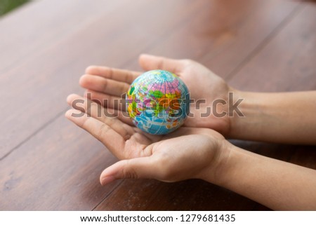  hand holding Earth globe model ball,Concept: Protecting the environment to save the world,The dream of sustainability for the new world,symbol responsibility safety  for happy
