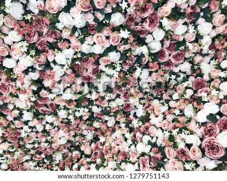 Background of bright colorful artificial flowers. 
