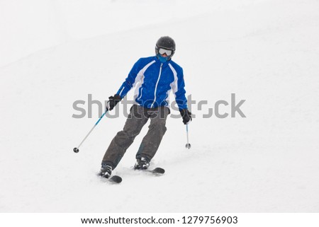 Skiing under the snow. Winter sport. Ski slope. Horizontal