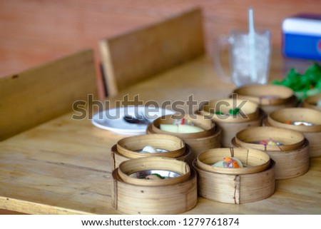 The background of the food that is put in the wooden bow (Dim Sum) is available in a variety of menus. It is a delicious food taste that has many provinces in Thailand and neighboring countries.