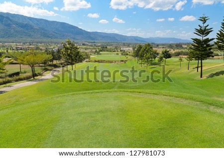 Beautiful golf course in the hill with blue sky background