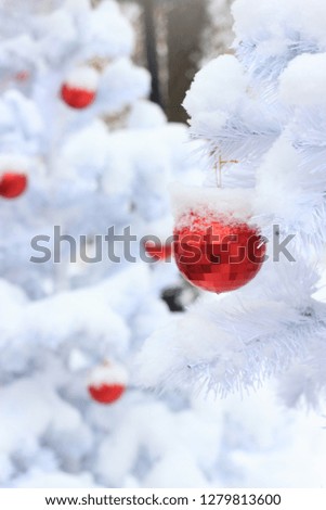 Red Christmas balls on the decorative Christmas tree