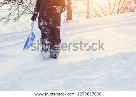 Little boy enjoying a sleigh ride. Child sledding. Toddler kid riding a sledge. Children play outdoors in snow. Kids sled in the Alps mountains in winter. Outdoor fun for family Christmas vacation.