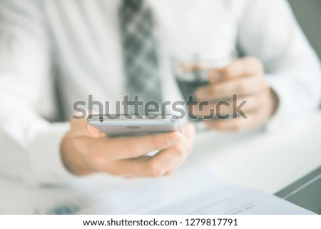 Businessman uses a smartphone. Close up telephone. Sending email, mobile phone. Shopping online. 