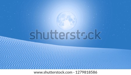 Night sky with blue moon in the clouds with desert (sand dune)"Elements of this image furnished by NASA