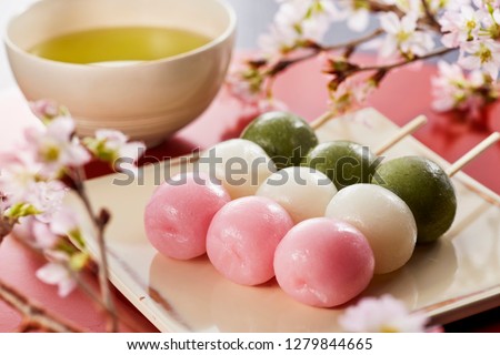 Sanshoku Dango (Three Colored Dumplings) and japanese tea, Cherry-blossom viewing image. Royalty-Free Stock Photo #1279844665