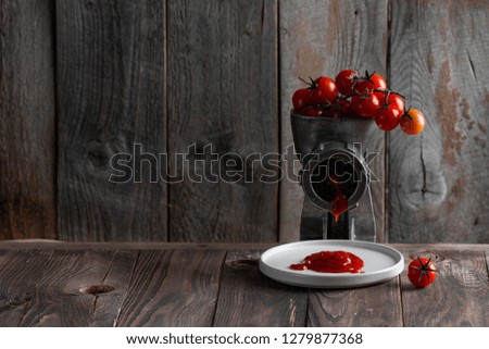 tomatoes on a branch on a wooden background with space for text. chopping tomatoes