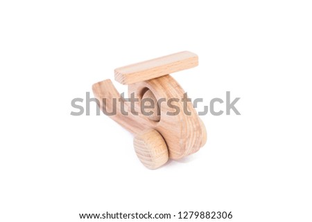 Photo of a wooden helicopter made of beech on a white isolated background