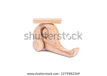 Photo of a wooden helicopter made of beech on a white isolated background