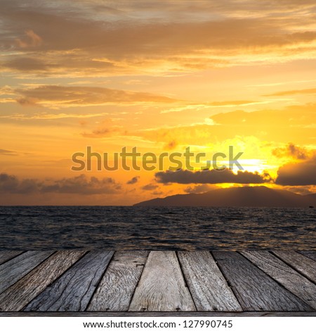 wood terrace perspective and sun set Royalty-Free Stock Photo #127990745