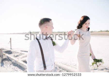 Bride and groom on a salt lake