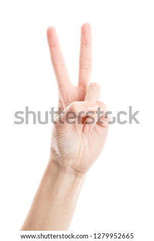 Female hand isolated on white background. White woman's hand showing symbols and gestures. Hands with two fingers up in peace or victory symbol. Sign in the letter