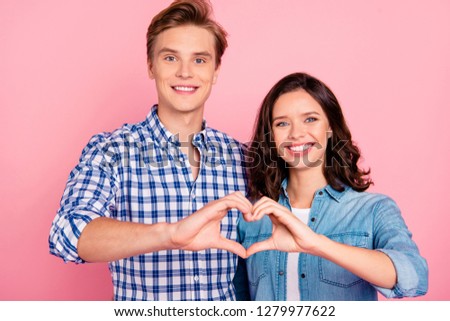 Close-up portrait of nice sweet charming lovely tender attractive cheerful cheery positive optimistic couple showing heart shape soulmate isolated over pink pastel background
