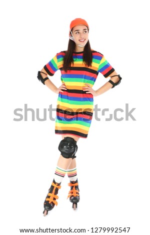 Full length portrait of young woman in bright dress with roller skates on white background