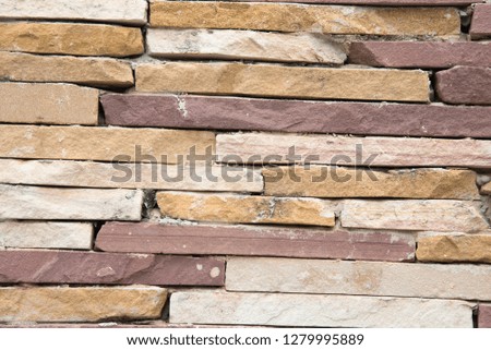 Sandstone bricks seamless of house wall texture background.