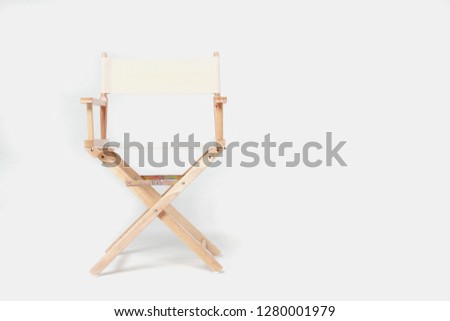 director chair made of wood and fabric well Comfortable sitting on a white backdrop, copy space