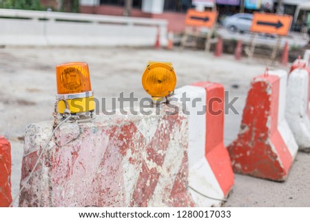 Barrier and siren in the road construction area