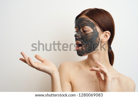 woman in clay mask on hand place free spa beauty