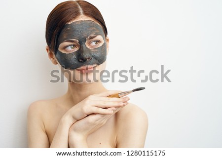 brush in hand clay mask care woman skin healthy