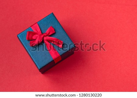 gift box on red background.background for Valentine's day and for the eighth March