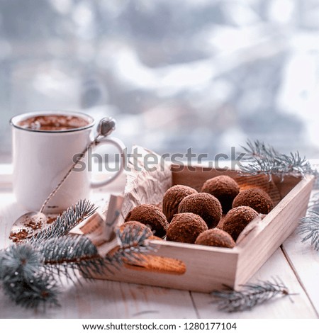 chocolates with a cup of coffee on the windowsill