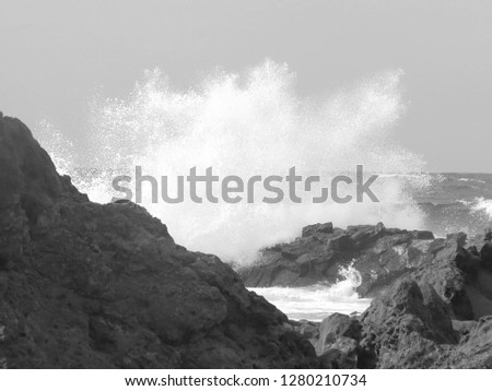 Breaking wave on rocks