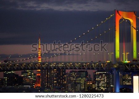 A beautiful scene of Tokyo tower and Rainbow bridge during twilight time