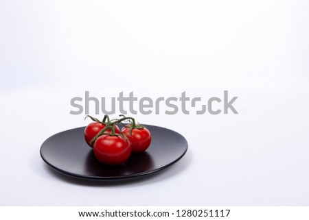 fresh tomatoes on plate