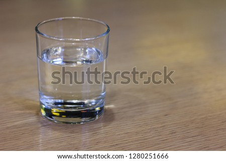 Glass of clear water on wooden table. . Healthy food - healthy lifestyle
