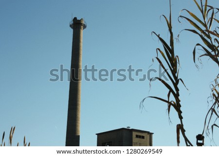 old disused factory with chimney for the discharge of toxic gases