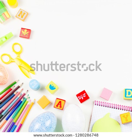 School supplies, child creativity concept flat lay. Various artistic tools for children on white desktop. Copy space