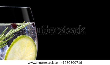 close up of gin tonic glass on black background Royalty-Free Stock Photo #1280300716