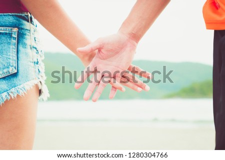 the people hold one's hand to showing love relationship.