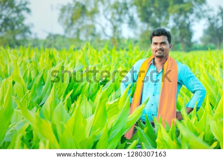 young indian farmer at field