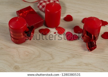 Close-up of gift boxes and heart shape decorations on wooden table