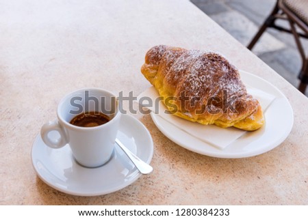 Coffee and croissant with dark chocolate.Top view and close-up.