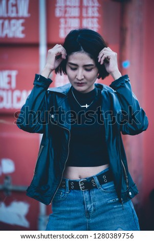 Portrait of beautiful asian chic girl pose for take a picture,Lifestyle of teen thailand people,Modern woman happy concept,Punk rock style