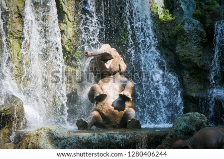 Elephant taking bath in waterfalls