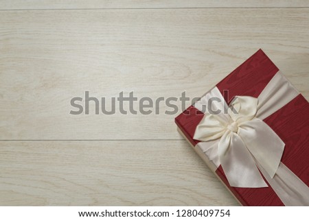 Close-up of gift box on a wooden table